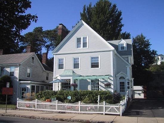 The Harborview Inn seen from Stacy Boulevard behind its white picket fence
