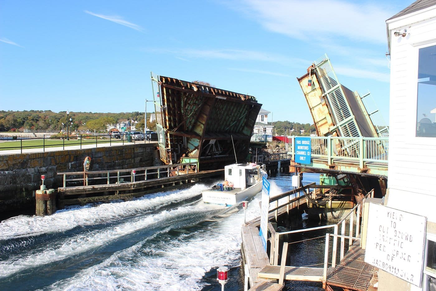 Gloucester's drawbridge raised over the harbour canal, a boat passing under